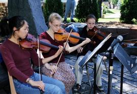 Three girls play violins together, Lemonade Concert and Art Fair, St. Cloud State University