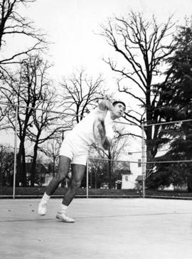 Mike Sundby hits a tennis ball, St. Cloud State University