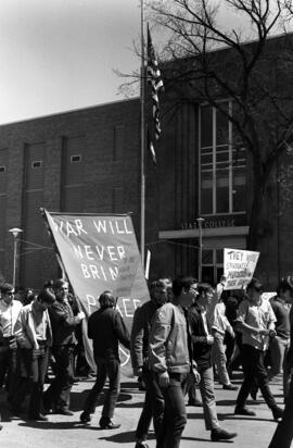 Vietnam war protestors march past Stewart Hall (1948), St. Cloud State University