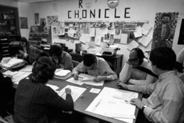 Chronicle newspaper staff Mike Knaak and others sit with Fran Voelker