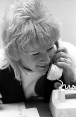 A woman talks on a telephone, KVSC trivia weekend, St. Cloud State University