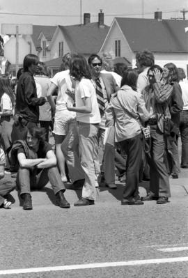 Protestors gather on a sidewalk, Day of Peace protest, St. Cloud State University