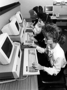 Students sit together using computers, St. Cloud State University