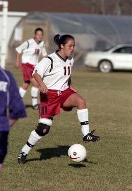 Kim Corbin kicks a soccer ball during a soccer game against Winona State University, St. Cloud State University