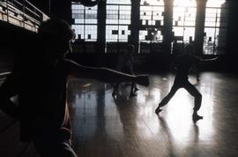 Students practice karate in Eastman Hall (1930) gymnasium, St. Cloud State University