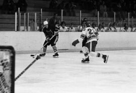 St. Cloud State hockey player Pat Sullivan looks to pass the puck against University of Illinois-Chicago Circle in men's hockey