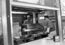 Dave and Bill Henning cook food at Val's Rapid Serve