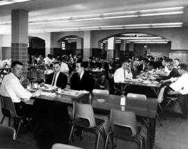 Men and women eat at the Stewart Hall (1948) cafeteria, St. Cloud State University