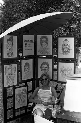 A woman displays her art, Lemonade Concert and Art Fair, St. Cloud State University