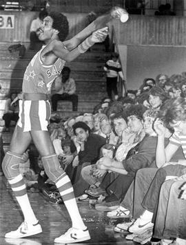 Harlem Globetrotter Twiggy Sanders throws water into the crowd, St. Cloud State University