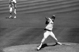 Baseball pitcher Pete Pratt throws a baseball, St. Cloud State University