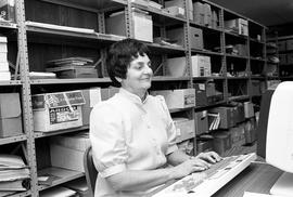 Marie Elsen enters data into a computer at University Archives, St. Cloud State University