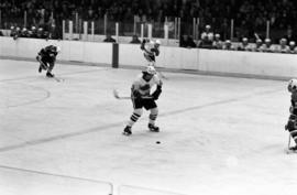 Hockey player Pat Sullivan readies to take a shot against St. John's University in men's hockey