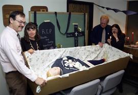 John Palmer, Mona Daniel, Carl Buraglio, and Ruth Litke attend a mock funeral for the department of Health Education and Traffic Safety, St. Cloud State University