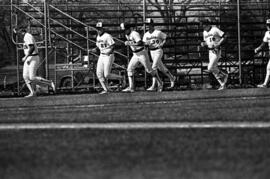 Players run together during a St. Cloud State University baseball game against Northern State University