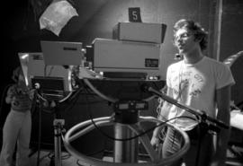 Man operates a television camera during a Mass Communications workshop, St. Cloud State University