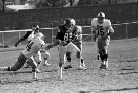 St. Cloud State University football player Mike Mullen runs the ball during a football against the University of Minnesota-Duluth