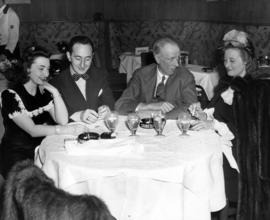 Sinclair Lewis, Marcella Powers, Leonard Lyons, and Red Sylvia Lyons visit the Stork Club, New York, New York