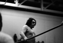 Wrestler Andre the Giant stands in the wrestling ring before a wrestling match at Halenbeck Hall (1965), St. Cloud State University