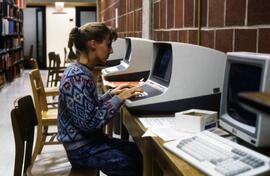 Woman uses a computer at Centennial Hall (1971), St. Cloud State University