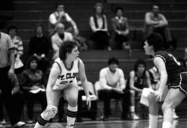 Dawn Anderson dribbles a basketball during a basketball game against the University of South Dakota, St. Cloud State University