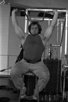 Paul Ellering lifts weights, St. Cloud State University