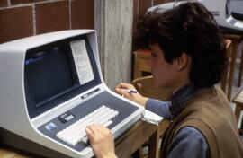 Woman uses a computer at Centennial Hall (1971), St. Cloud State University