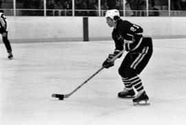 St. Cloud State hockey player Pat Sullivan handles the puck against St. John's University in men's hockey