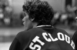 Dan Hagen sits on the bench during a basketball game against Northern State College, St. Cloud State University