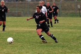 Kim Corbin kicks a soccer ball during a soccer game, St. Cloud State University