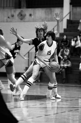 St. Cloud State basketball player Sue Wahl looks to pass during a game against the University of Minnesota at Halenbeck Hall (1965)