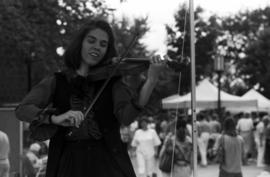 A woman plays a violin, Lemonade Concert and Art Fair, St. Cloud State University