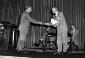 Wilbur Holes accepts key from Earl Berg to Kiehle (1952), St. Cloud State University