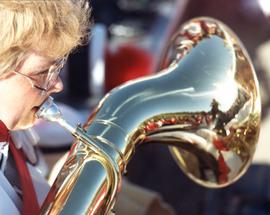 Student plays a tuba, St. Cloud State University