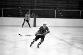 Hockey player John Fitzsimmons skates during a game against the University of Wisconsin-Superior, St. Cloud State University