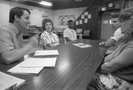 Greg Trunk, Kathy Spoden, Todd Womack, Kurt Stelten, and Christine Albright gather at a KIDSTOP meeting