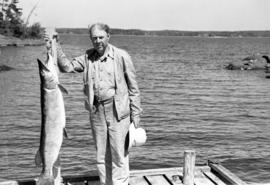 Claude Lewis and a fish