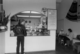 Man stands at the counter at Bravo Burritos