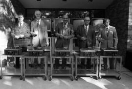 St. Cloud State president Charles Graham, state architectural engineer Paul Cummings, Jack Kleinbaum, Delbert Anderson, and Jim Pehler prepare to cut the electronic ribbon at the Kiehle (1952) rededication, St. Cloud State University