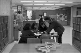 Keith Ewing helps students at Centennial Hall (1971), St. Cloud State University