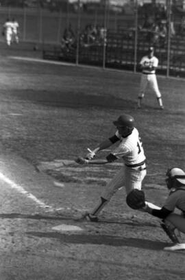 St. Cloud State baseball player swings a bat during a baseball game against the University of Minnesota-Morris
