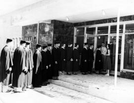 Students enter Kiehle (1952) for commencement, St. Cloud State University
