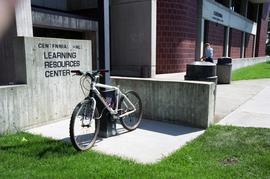 Bicycle parked in front of Centennial Hall (1971), St. Cloud State University