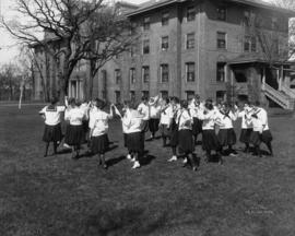 Women exercise near Lawrence Hall (1905), St. Cloud State University