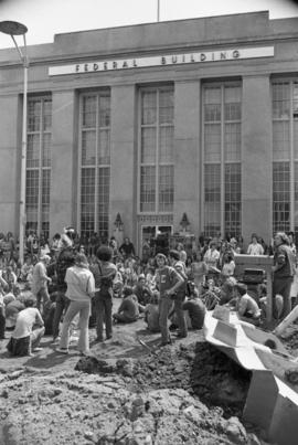 Protestors gather at a building, Day of Peace protest, St. Cloud State University