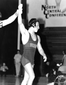 A wrestler wins a match, St. Cloud State University