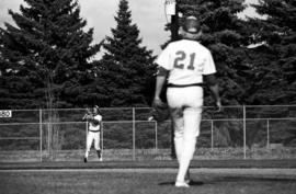 Jim Eisenreich catches a baseball while teammate Cary Swenson looks on during a St. Cloud State University baseball game against Southwest State University