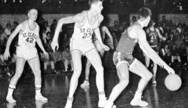 St. Cloud State University basketball players John Blomlie and Gene Anfinson defend against Moorhead State University in men's basketball