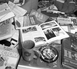 Books, magazines, and an ashtray at the Chainsaws for God trivia headquarters, KVSC trivia weekend, St. Cloud State University