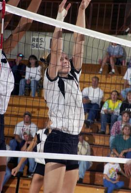 Volleyball player Kim Pellman blocks a shot during a game against the University of North Dakota